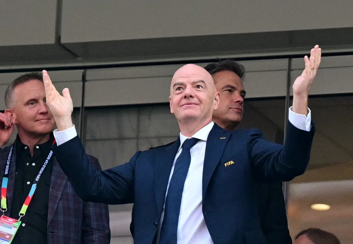 FIFA official gesturing from VIP box during event FIFA official gesturing from VIP box during event