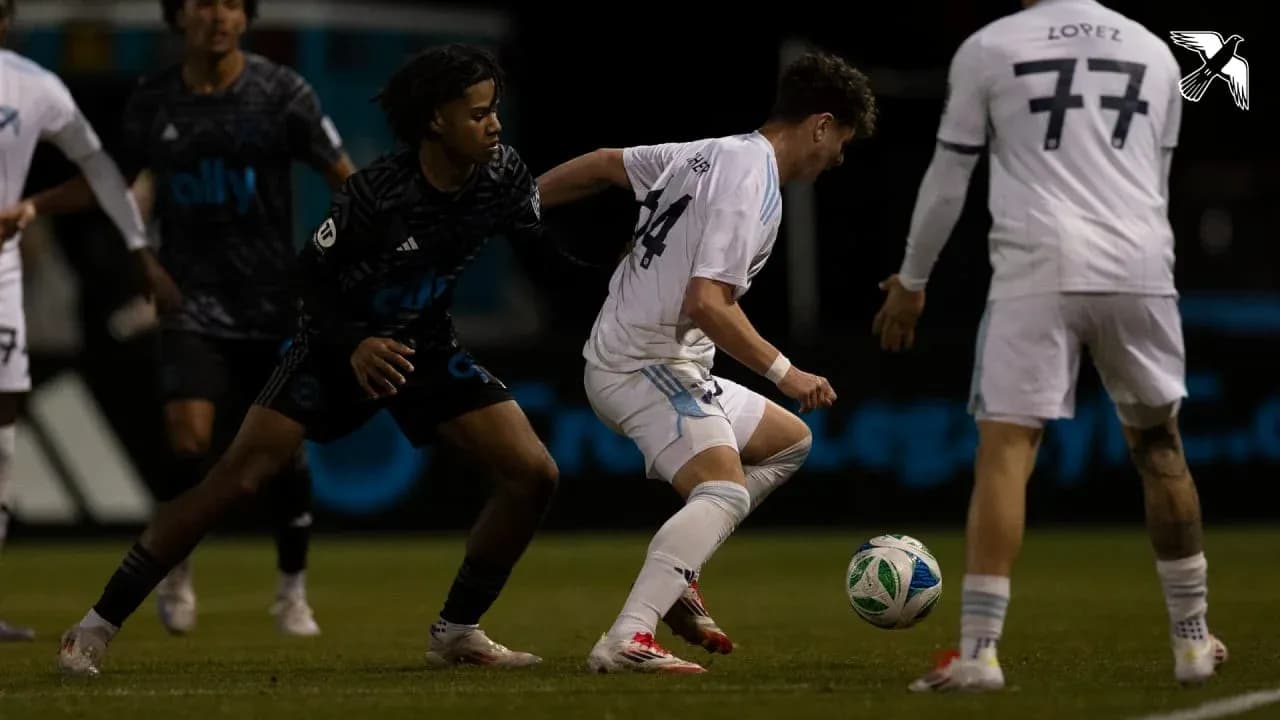 Players competing for the ball in MLS Next Pro match Players competing for the ball in MLS Next Pro match