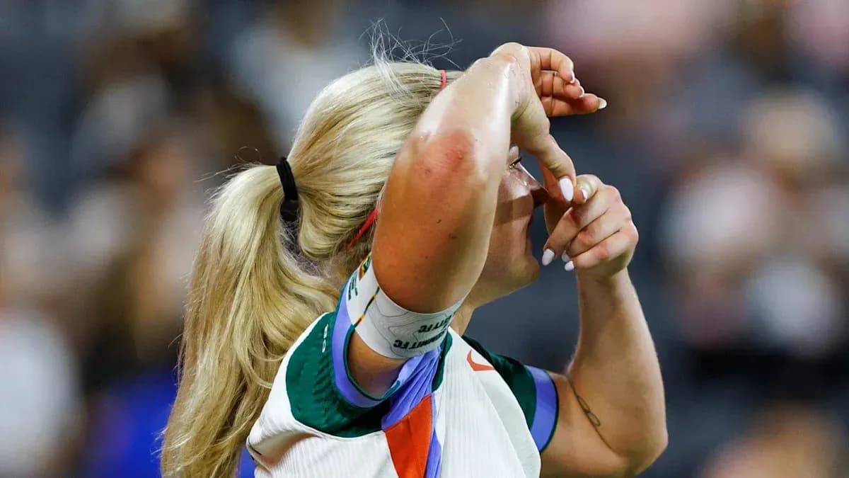 Athlete adjusting headband during a match Athlete adjusting headband during a match