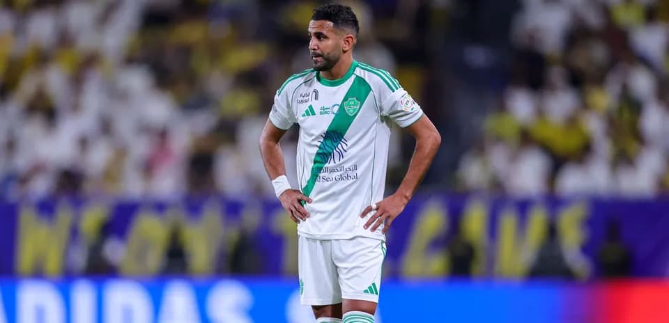 Player in green and white kit during match Player in green and white kit during match