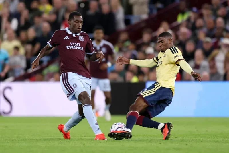 Player tackling opponent during a football match Player tackling opponent during a football match
