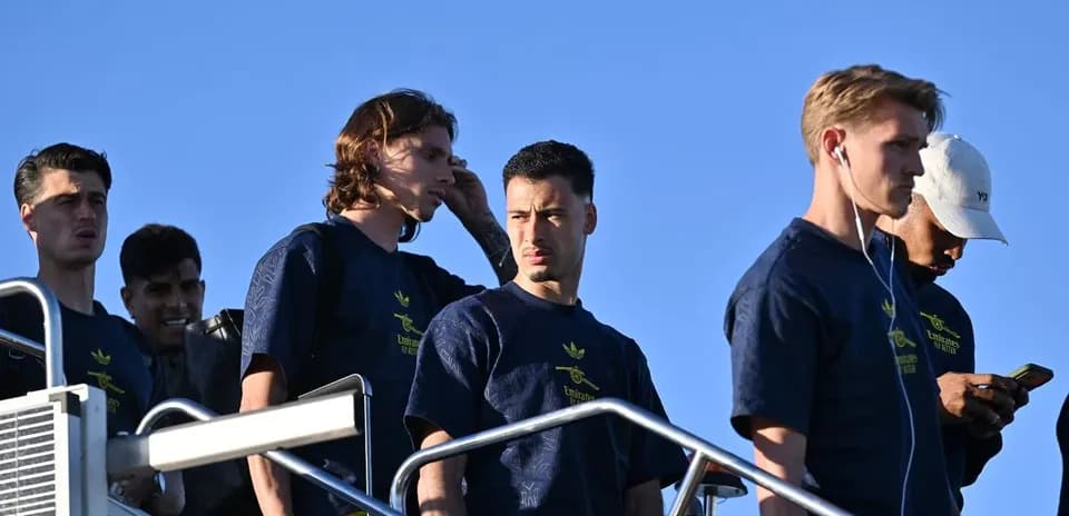Players walking down steps in team apparel Players walking down steps in team apparel