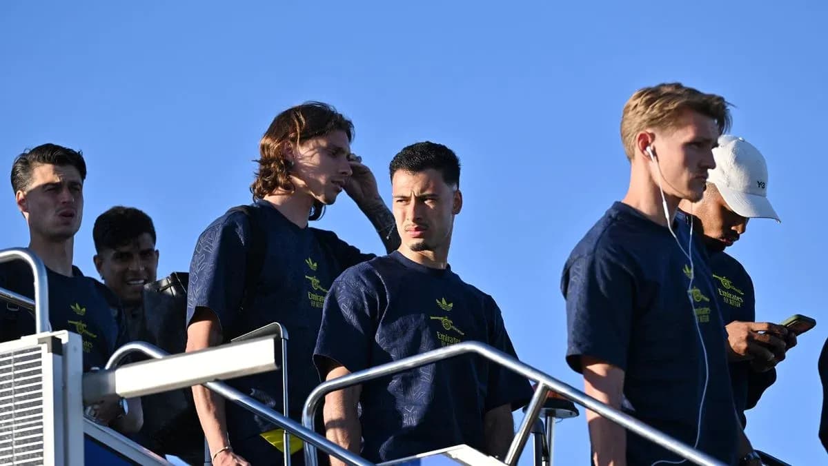 Players walking down steps in team apparel Players walking down steps in team apparel