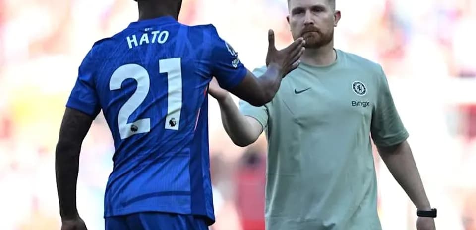 Player Hato greeting Chelsea staff during match Player Hato greeting Chelsea staff during match