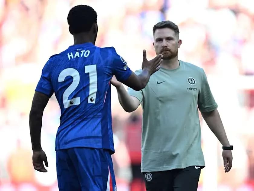 Player Hato greeting Chelsea staff during match Player Hato greeting Chelsea staff during match