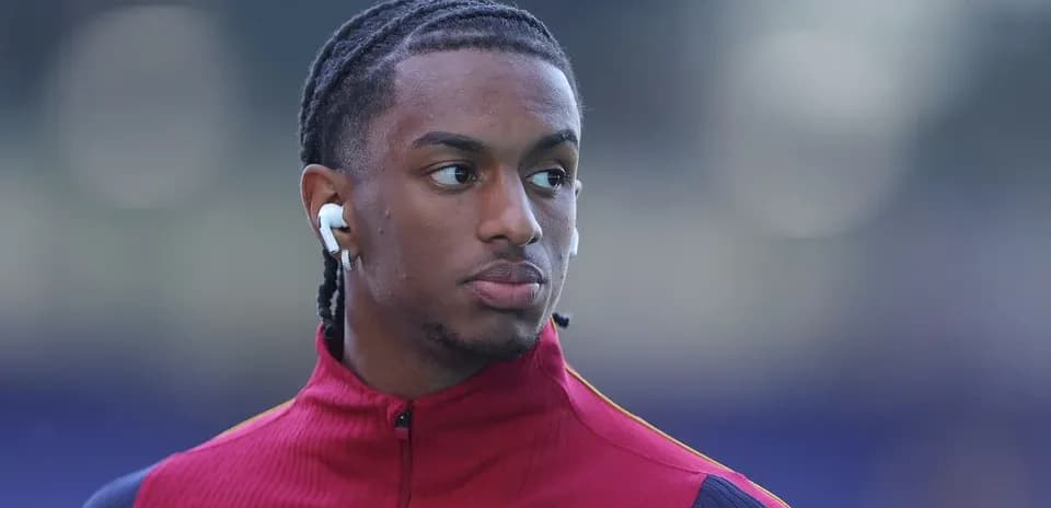 Player wearing earbuds during warm-up before match Player wearing earbuds during warm-up before match