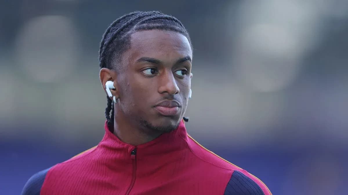 Player wearing earbuds during warm-up before match Player wearing earbuds during warm-up before match