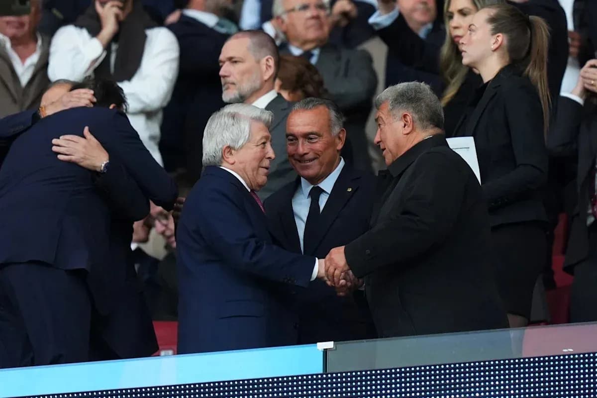 Three officials shaking hands in stadium stands Three officials shaking hands in stadium stands