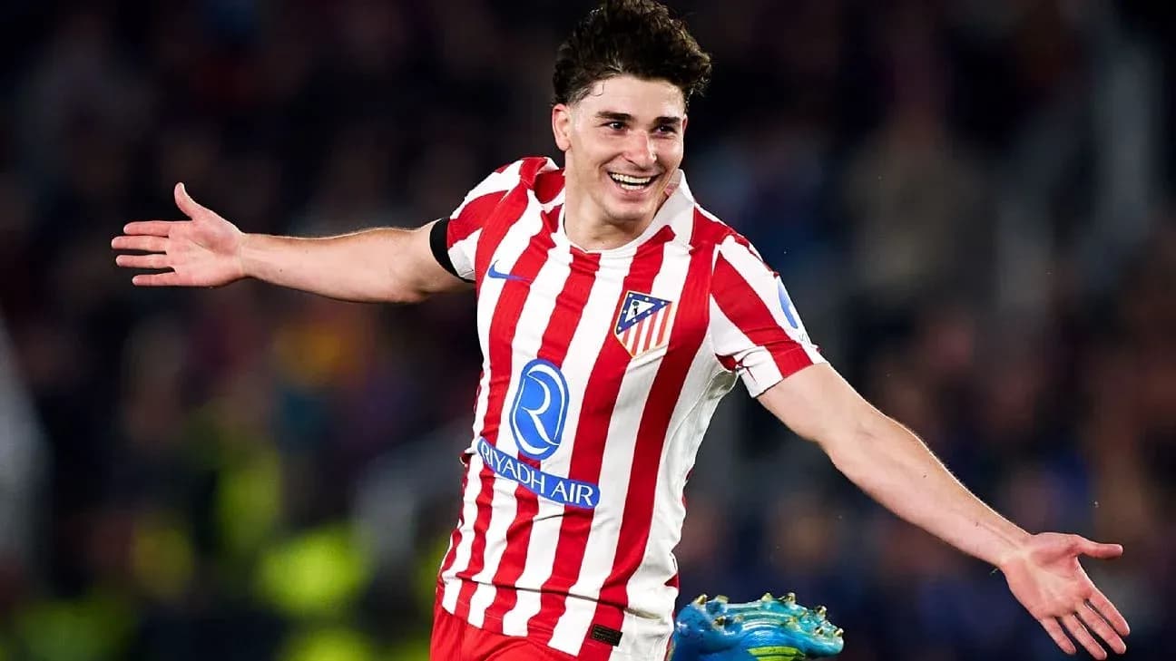 Atletico Madrid player celebrating a goal on pitch Atletico Madrid player celebrating a goal on pitch