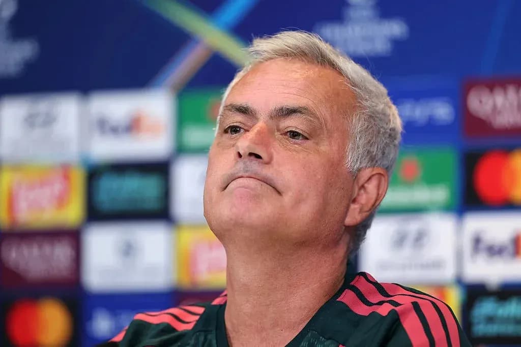 Manager at press conference with Champions League backdrop Manager at press conference with Champions League backdrop