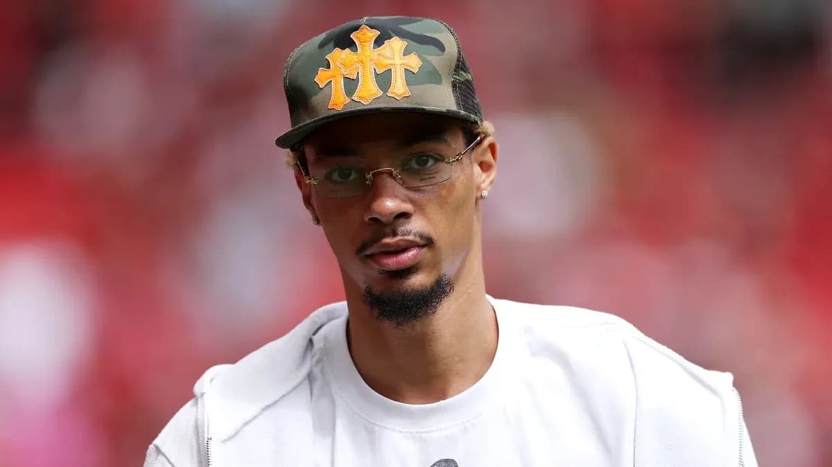 Man wearing a camo cap and glasses Man wearing a camo cap and glasses