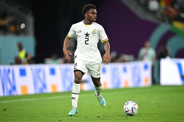 Ghana player dribbling the ball during match Ghana player dribbling the ball during match