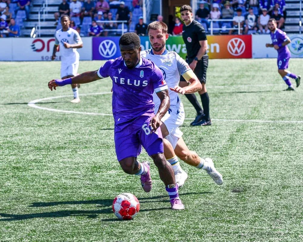 Player dribbling ball during Pacific FC match Player dribbling ball during Pacific FC match