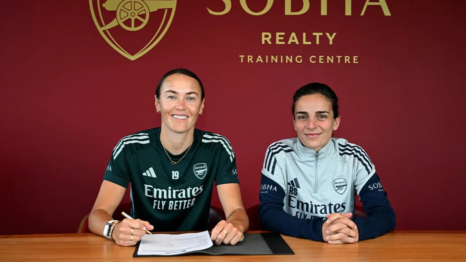 Players signing contracts at Arsenal training center Players signing contracts at Arsenal training center