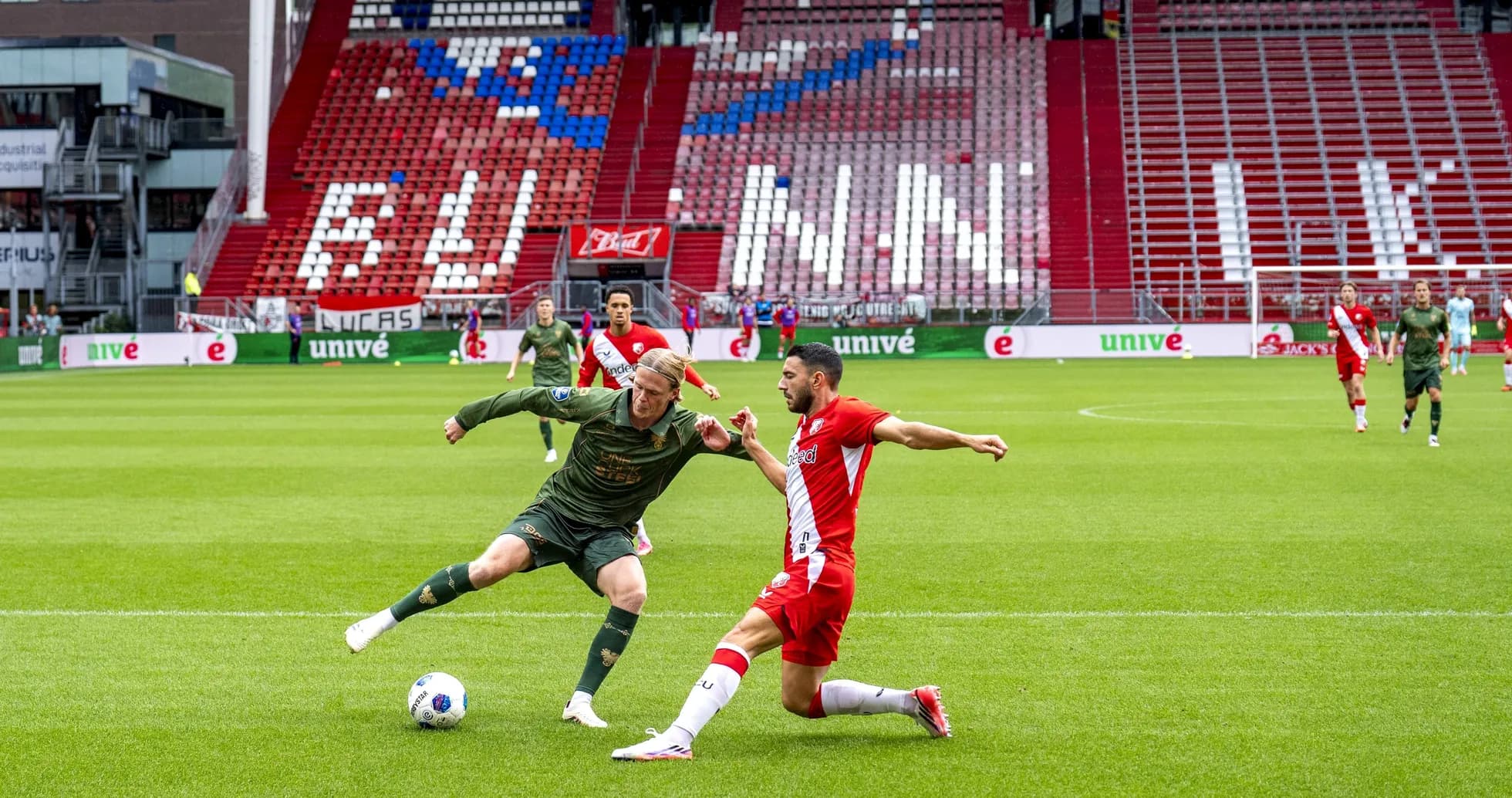 Two players challenging for the ball during match Two players challenging for the ball during match