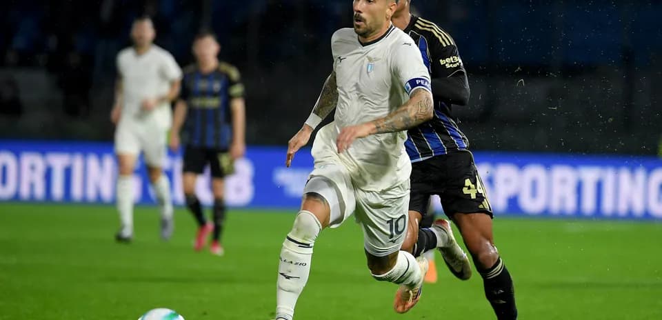 Lazio player dribbling past Pisa defender Lazio player dribbling past Pisa defender