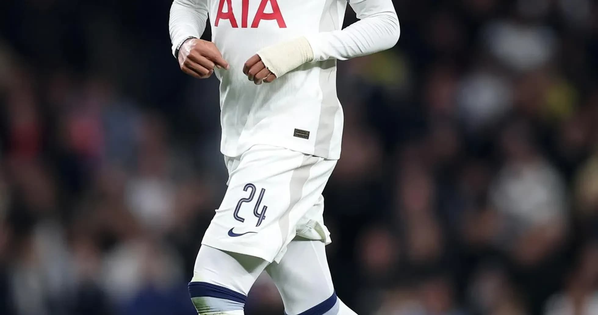 Player in Tottenham kit running with soccer ball Player in Tottenham kit running with soccer ball