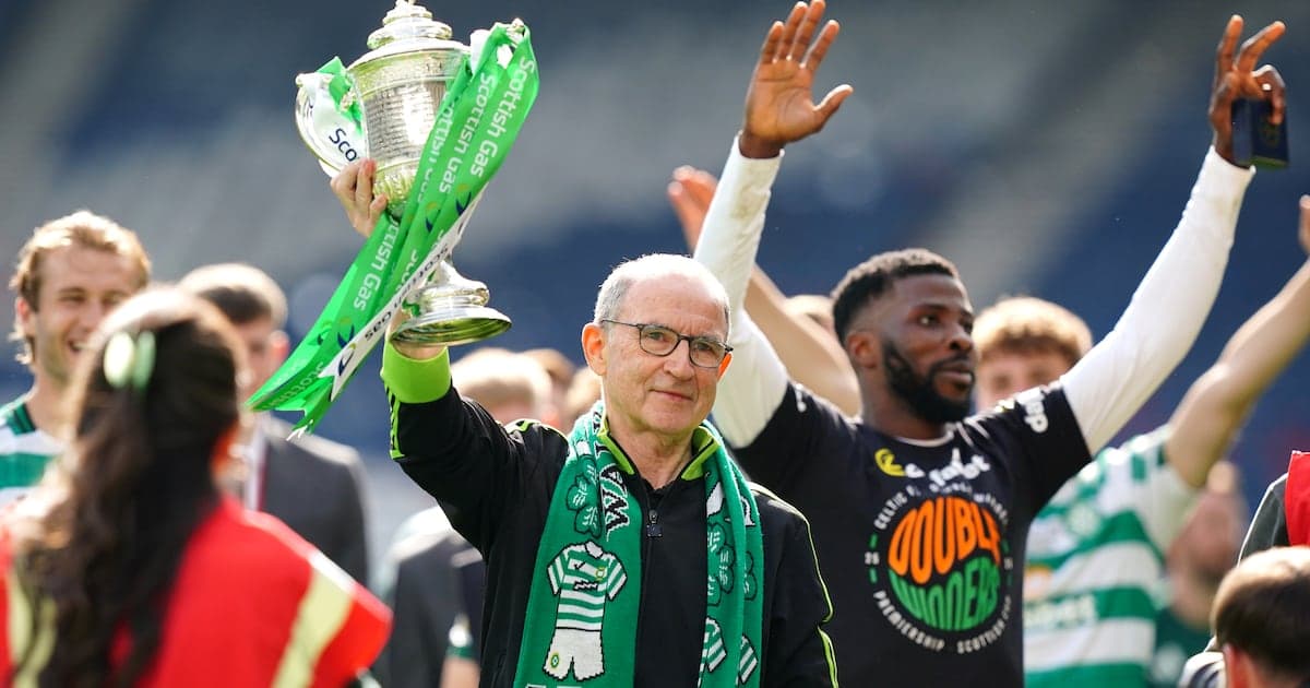 Man holding trophy with green ribbons, celebrating victory Man holding trophy with green ribbons, celebrating victory