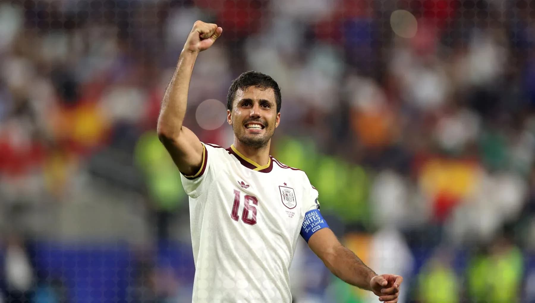 Player celebrating victory with raised fist Player celebrating victory with raised fist