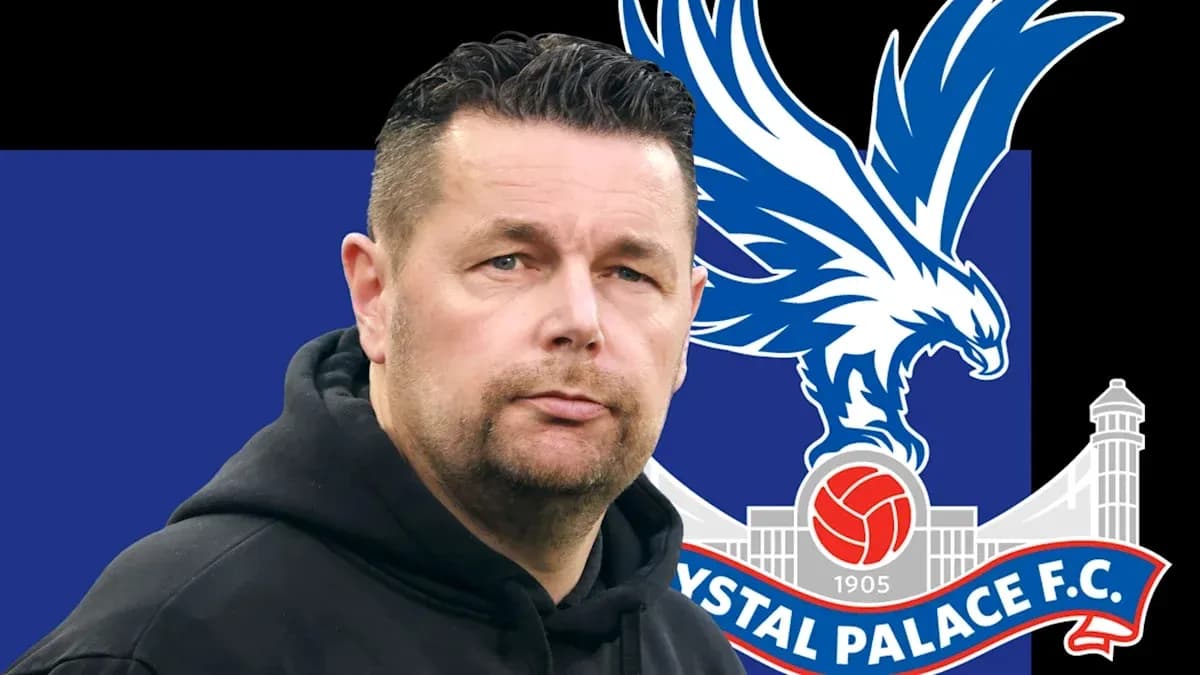 Coach in front of Crystal Palace F.C. logo Coach in front of Crystal Palace F.C. logo