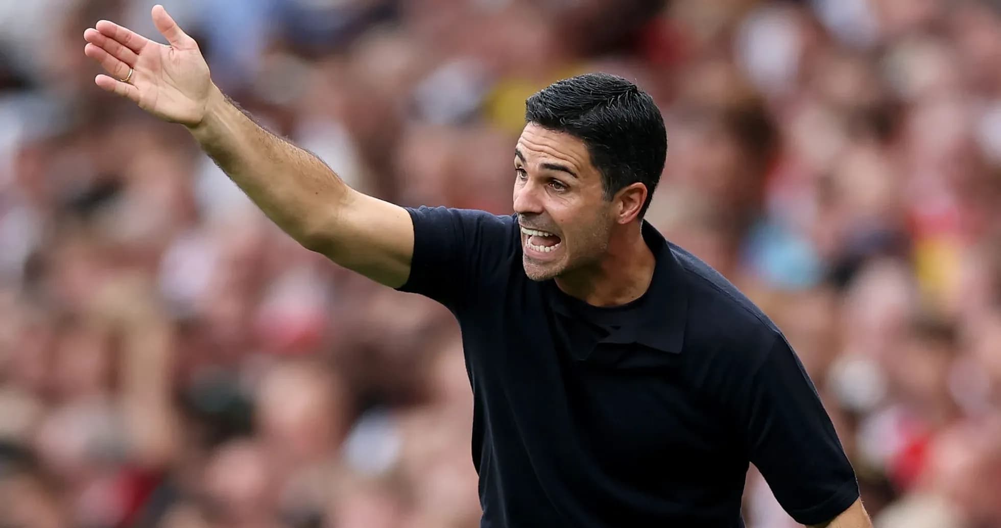 Coach gesturing during a football match on the sidelines Coach gesturing during a football match on the sidelines