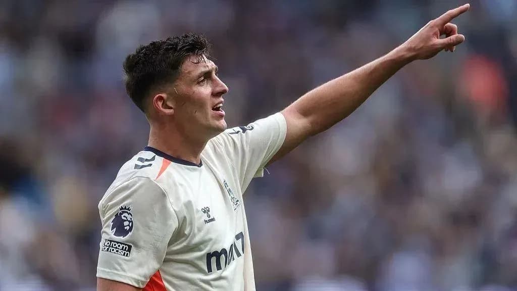 Player gesturing during a football match Player gesturing during a football match