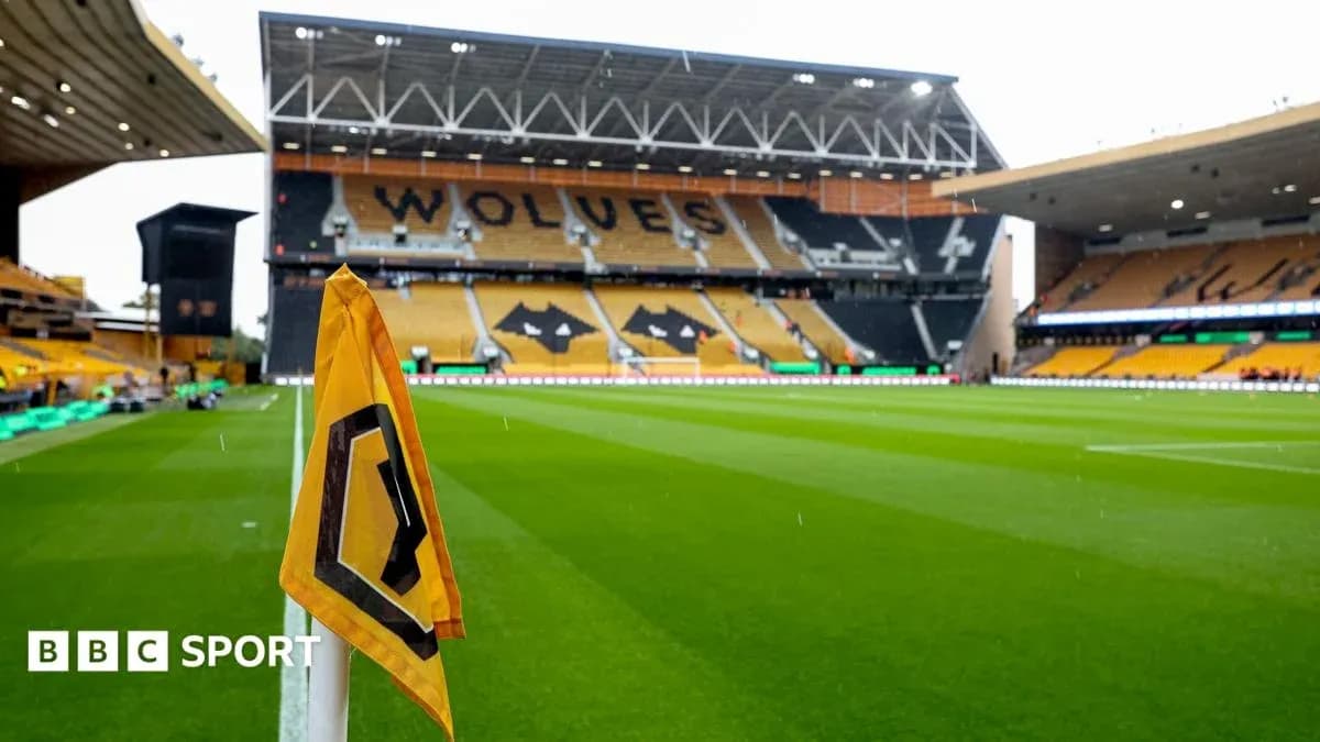 Corner flag in front of empty stadium seats Corner flag in front of empty stadium seats