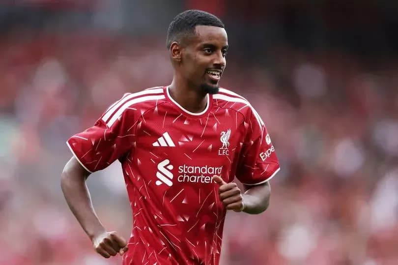Player celebrating during Liverpool match at stadium Player celebrating during Liverpool match at stadium