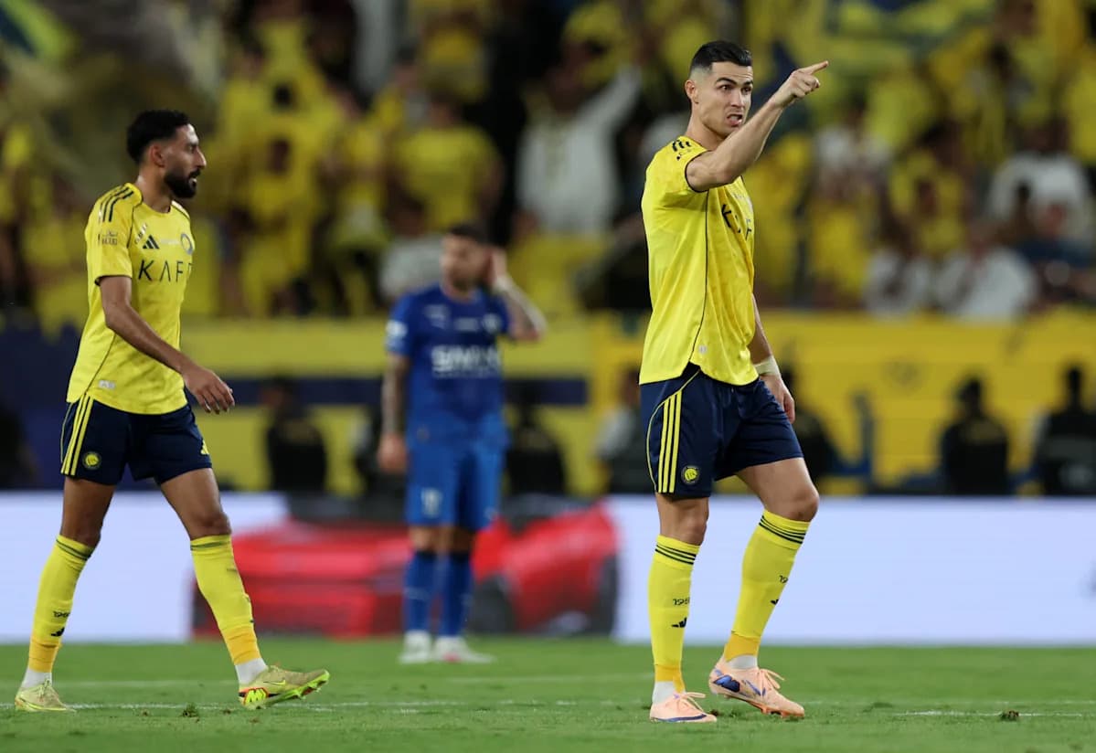 Two players in yellow jerseys during a match Two players in yellow jerseys during a match