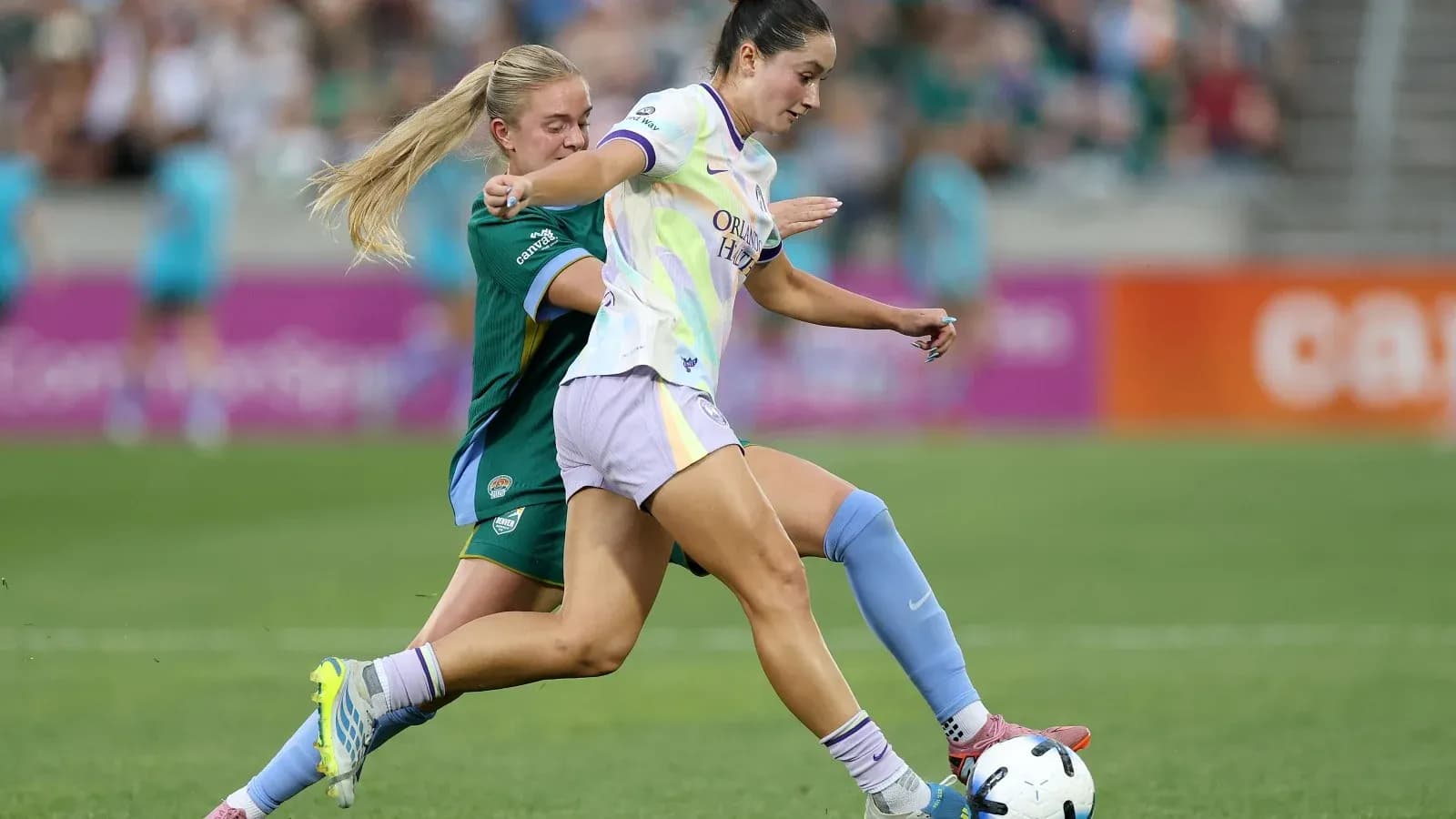 Orlando Pride player dribbling past Bay FC opponent Orlando Pride player dribbling past Bay FC opponent