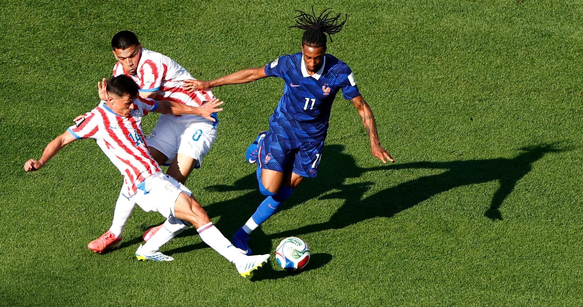 Paraguay and France players contesting for the ball Paraguay and France players contesting for the ball