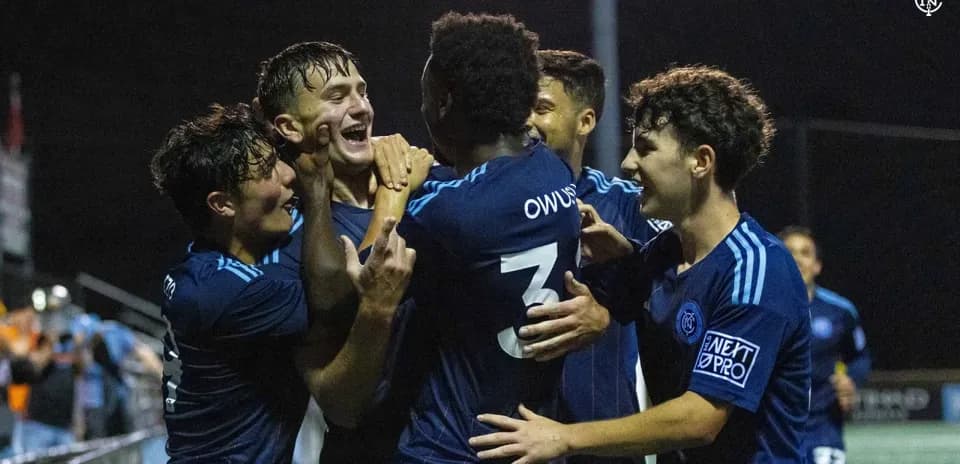 Players celebrating a goal during match Players celebrating a goal during match