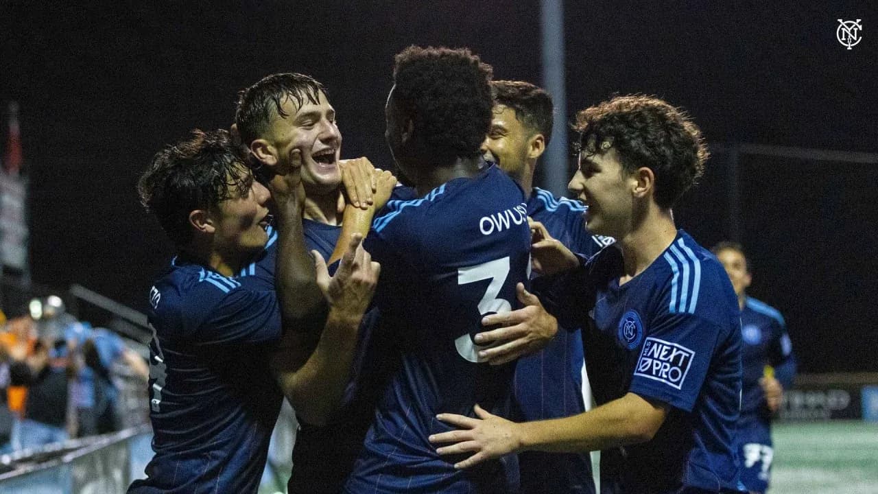 Players celebrating a goal during match Players celebrating a goal during match