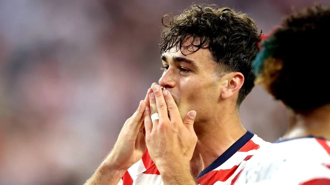 Player celebrating with hands near mouth after match Player celebrating with hands near mouth after match