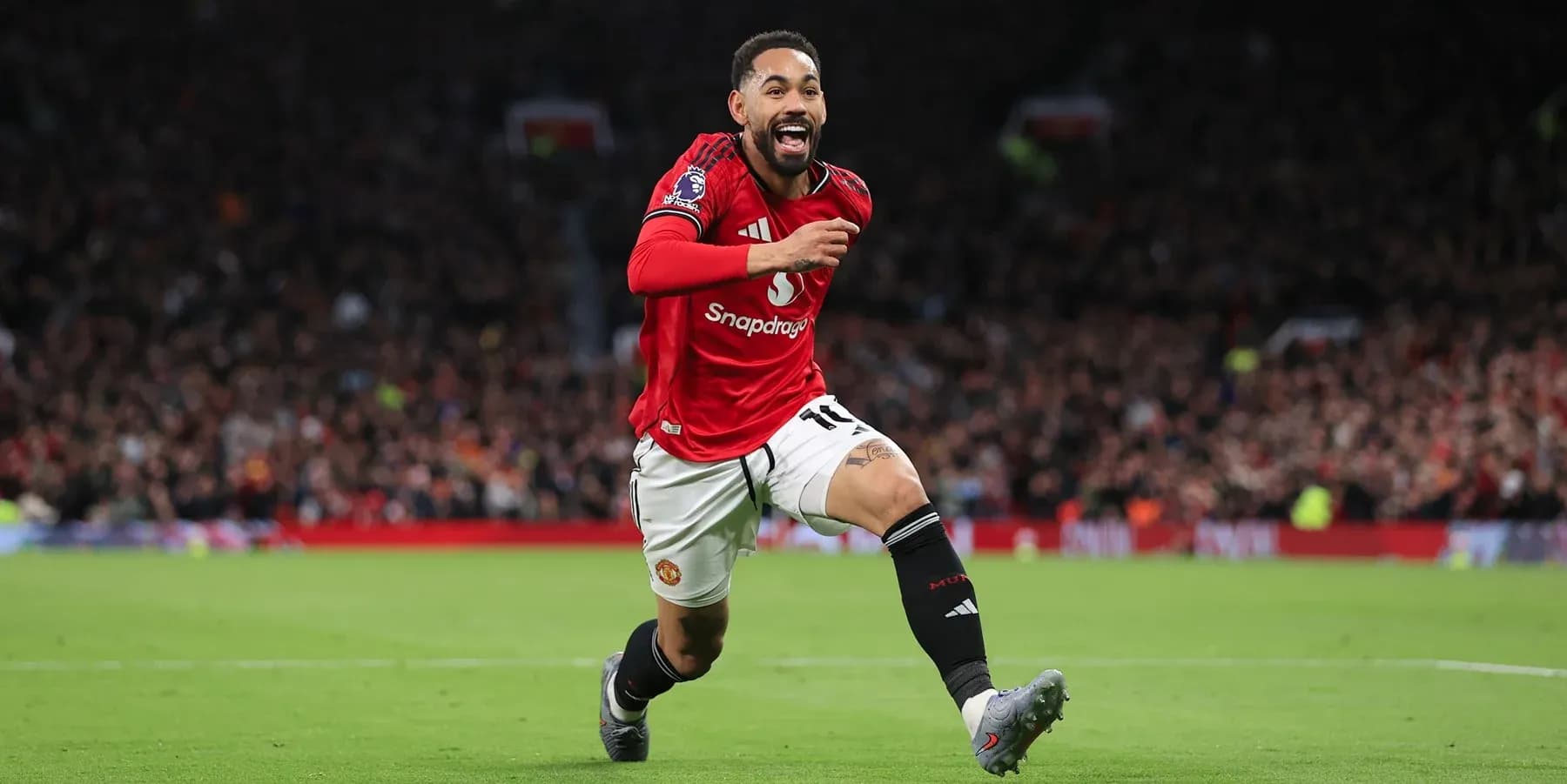 Manchester United player celebrating a goal Manchester United player celebrating a goal