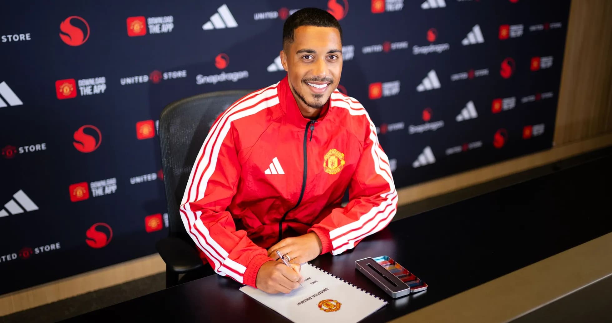 Player signing contract at Manchester United press event Player signing contract at Manchester United press event