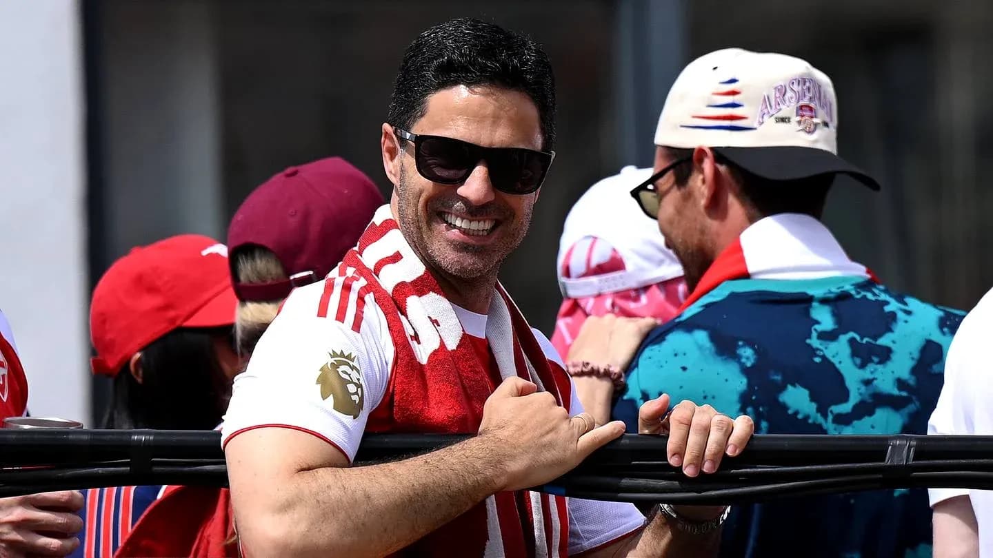 Man in sunglasses smiling at a celebration event Man in sunglasses smiling at a celebration event