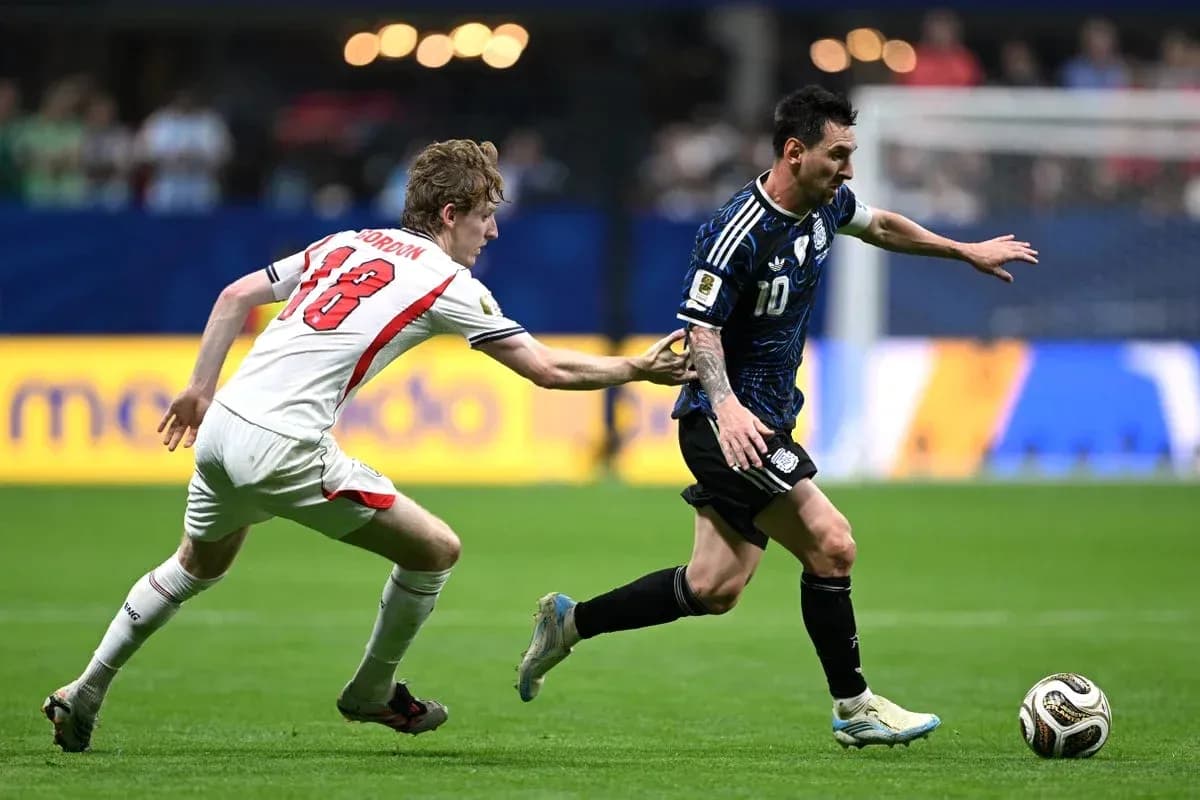 Player in blue jersey evading defender during match Player in blue jersey evading defender during match