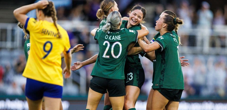 Players celebrating a goal during match Players celebrating a goal during match