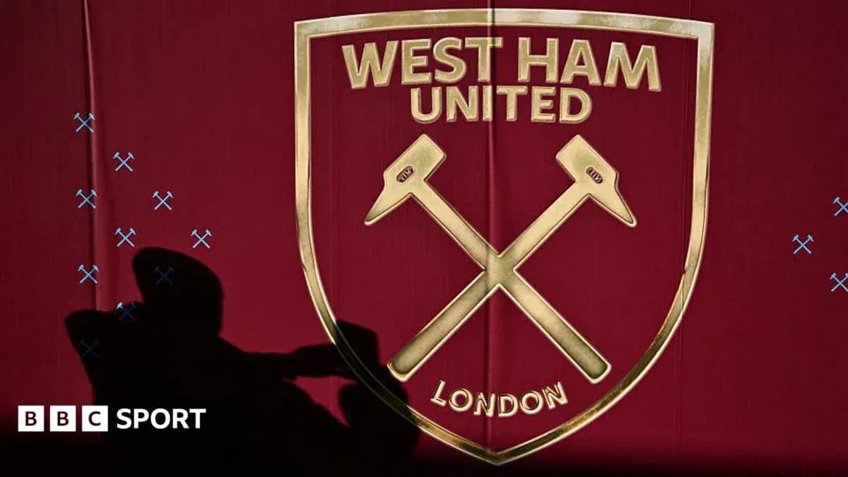 West Ham United logo displayed on a maroon background West Ham United logo displayed on a maroon background