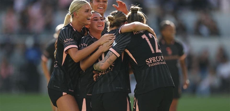 Players celebrating a goal during match Players celebrating a goal during match
