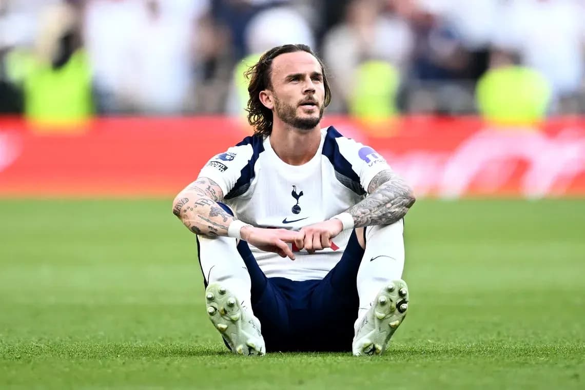 Tottenham player sitting on the pitch after match Tottenham player sitting on the pitch after match