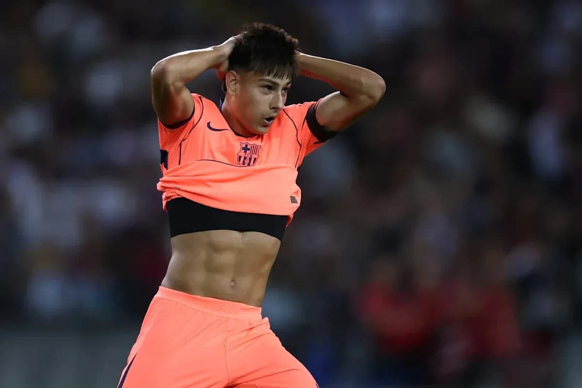 Player adjusting jersey during match on field Player adjusting jersey during match on field