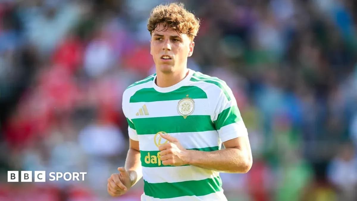 Player in Celtic kit running on the pitch Player in Celtic kit running on the pitch