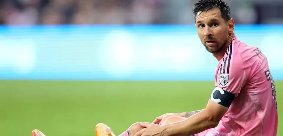 Player sitting on the field during a match Player sitting on the field during a match