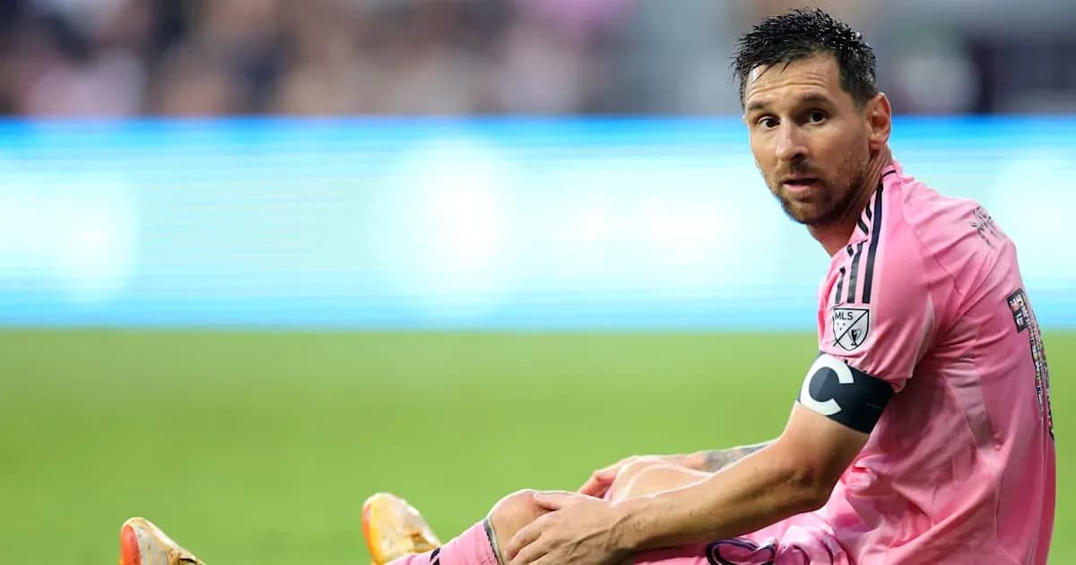 Player sitting on the field during a match Player sitting on the field during a match