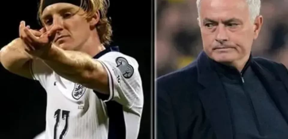 Football player gesturing and coach observing match Football player gesturing and coach observing match
