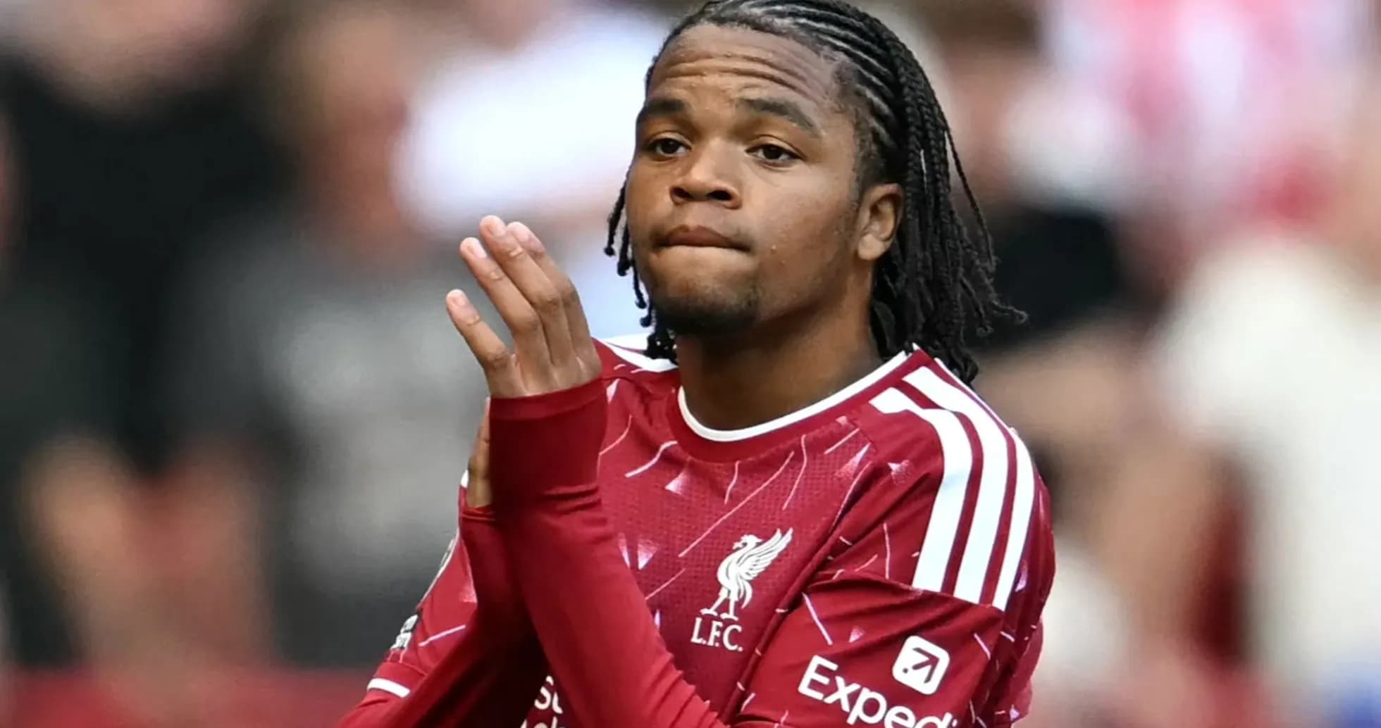 Player in Liverpool jersey clapping to the crowd Player in Liverpool jersey clapping to the crowd