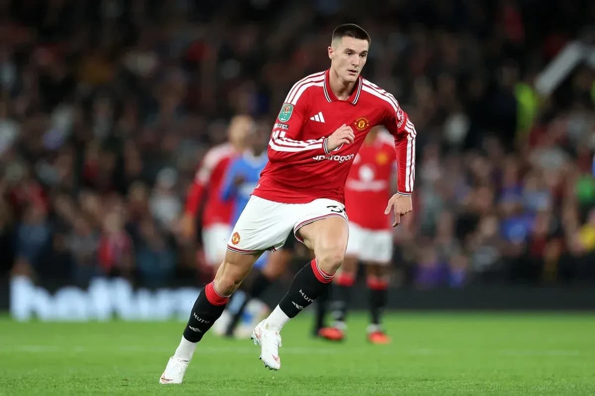 Manchester United player sprinting during a match Manchester United player sprinting during a match