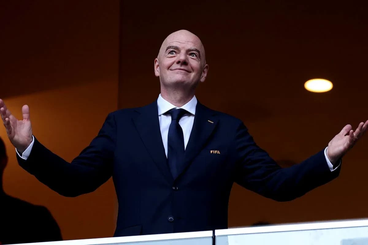 FIFA official gesturing from a balcony FIFA official gesturing from a balcony